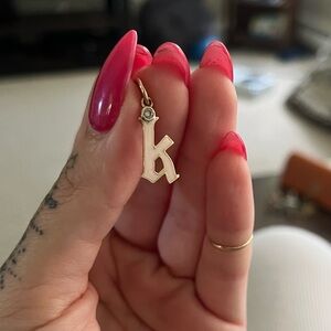 Diamond, gold and enamel gothic initial pendant